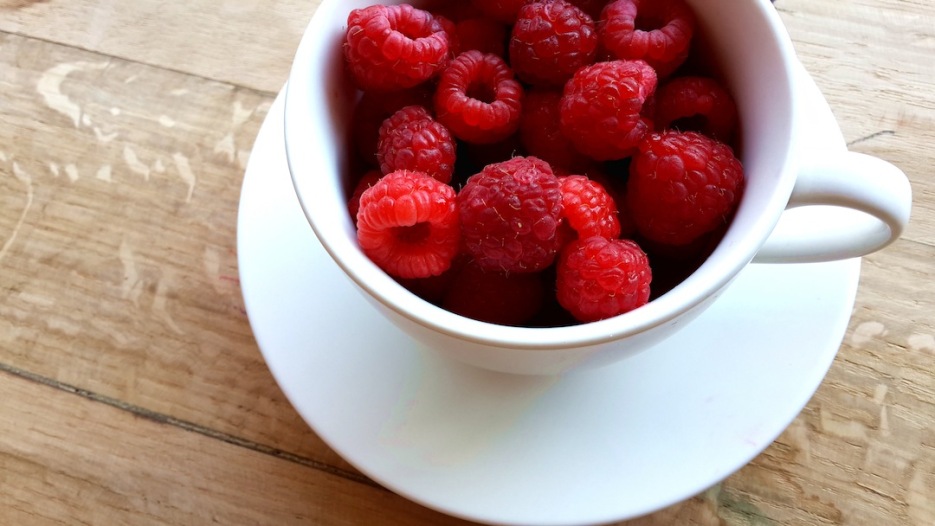 raspberries in teacup