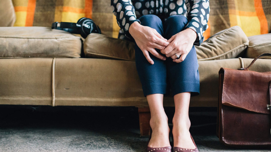 woman sitting on couch